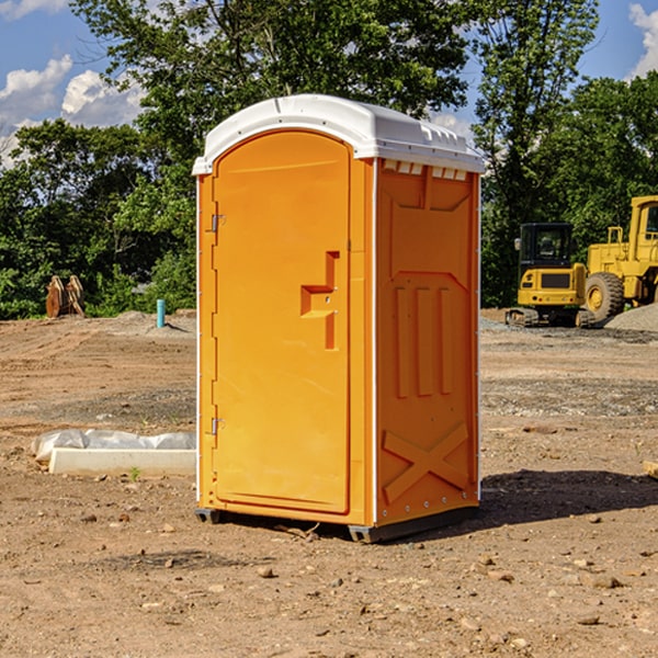 what is the cost difference between standard and deluxe portable toilet rentals in Dinero